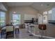 Eat-in kitchen with white cabinets, stainless appliances, a breakfast bar, and pendant lighting at 12618 Greco Dr, Orlando, FL 32824