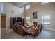 Spacious living room boasts a fireplace, high ceilings, clerestory windows, and wood-look flooring at 12618 Greco Dr, Orlando, FL 32824