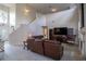 An open-concept living room with a fireplace, entertainment center, and wood-look flooring at 12618 Greco Dr, Orlando, FL 32824