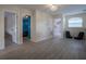 Upstairs bonus room with hardwood floors, access to bedrooms, and comfortable seating at 12618 Greco Dr, Orlando, FL 32824