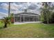 A large screened-in pool area provides a relaxing backyard oasis with ample space for outdoor seating at 12618 Greco Dr, Orlando, FL 32824
