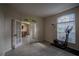 Versatile room with wood-look flooring and an arched window, perfect for a home office or exercise area at 12618 Greco Dr, Orlando, FL 32824