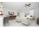 Spacious open floorplan with neutral tones, featuring living, dining, and kitchen areas at 12732 Sw 33Rd Ave, Ocala, FL 34473