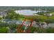 Aerial view highlighting a home with a screened-in pool near a lake at 14231 Sonco Ave, Windermere, FL 34786