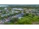Aerial view of the neighborhood with community buildings, pools, and green spaces visible at 14231 Sonco Ave, Windermere, FL 34786