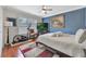 Bedroom with an elliptical, TV and a cozy rug at 14231 Sonco Ave, Windermere, FL 34786