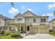 Charming two-story home featuring a welcoming front porch and a two-car garage at 14231 Sonco Ave, Windermere, FL 34786