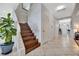 Spacious foyer showcasing the staircase and decorative tile flooring at 14231 Sonco Ave, Windermere, FL 34786