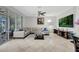 Bright living room with tile floors, a comfortable L-shaped sofa, and sliding glass doors to the outdoors at 14231 Sonco Ave, Windermere, FL 34786