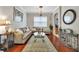 Elegant living room showcasing neutral walls, hardwood flooring, a chandelier, and comfortable seating at 14231 Sonco Ave, Windermere, FL 34786