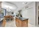 Open-concept living space features tile flooring, natural lighting, and a staircase leading to the upper level at 14231 Sonco Ave, Windermere, FL 34786