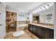 Beautiful main bathroom with dual sinks, tile shower, and relaxing tub at 14231 Sonco Ave, Windermere, FL 34786