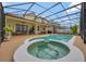Screened-in pool and spa with an outdoor patio, perfect for relaxation and entertainment at 14231 Sonco Ave, Windermere, FL 34786