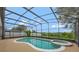 Beautiful screened-in pool and jacuzzi with lovely surroundings and ample space for relaxation and recreation at 14231 Sonco Ave, Windermere, FL 34786