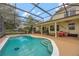 Outdoor screened-in pool and jacuzzi area providing great space for entertaining, recreation, and leisure at 14231 Sonco Ave, Windermere, FL 34786