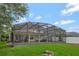 Enjoy the outdoors in this screened patio with ample seating, perfect for entertaining or relaxing at 14231 Sonco Ave, Windermere, FL 34786