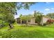 Private backyard with lush landscaping and a screened-in lanai, ideal for relaxation and outdoor enjoyment at 1428 Lucky Pennie Way, Apopka, FL 32712