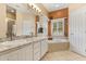 Bathroom features dual sinks, granite countertops, and a tub at 1428 Lucky Pennie Way, Apopka, FL 32712