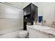 Bathroom showcasing a vanity with granite countertop and a shower with glass doors providing a sleek and functional space at 1428 Lucky Pennie Way, Apopka, FL 32712