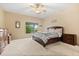 Spacious bedroom with a ceiling fan and natural lighting at 1428 Lucky Pennie Way, Apopka, FL 32712