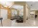 Elegant dining area with a stylish chandelier, a large window with shutters, and easy access to the kitchen at 1428 Lucky Pennie Way, Apopka, FL 32712