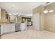 Open kitchen features granite countertops and stainless steel appliances at 1428 Lucky Pennie Way, Apopka, FL 32712