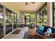 Inviting lanai featuring comfortable seating and serene views of the meticulously maintained backyard at 1428 Lucky Pennie Way, Apopka, FL 32712