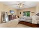 Main bedroom features a ceiling fan and closet space at 1428 Lucky Pennie Way, Apopka, FL 32712
