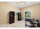 Spacious office with natural light, complemented by built-in shelving units for storage at 1428 Lucky Pennie Way, Apopka, FL 32712