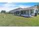 Backyard with well-maintained lawn and patio at 14650 Laguna Beach Cir, Orlando, FL 32824