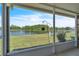 Screened patio with view of lush lawn and tranquil lake at 14650 Laguna Beach Cir, Orlando, FL 32824