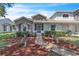 Charming townhome with a meticulously landscaped front yard and a welcoming walkway at 14650 Laguna Beach Cir, Orlando, FL 32824