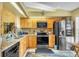 The kitchen features granite countertops, stainless steel appliances, and wood cabinetry at 14650 Laguna Beach Cir, Orlando, FL 32824