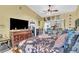 Comfortable main bedroom with a ceiling fan, stylish decor and access to outdoor area at 14650 Laguna Beach Cir, Orlando, FL 32824