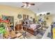 Bright main bedroom boasts stylish decor, a ceiling fan, and plenty of natural light at 14650 Laguna Beach Cir, Orlando, FL 32824