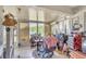 Sunroom with tiled floors, lots of natural light, and views of lake at 14650 Laguna Beach Cir, Orlando, FL 32824