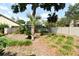 Spacious fenced backyard with a mix of trees and foliage at 1575 N Ridge Lake Cir, Longwood, FL 32750