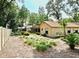 Large yard featuring mature landscaping, a screened porch and fencing at 1575 N Ridge Lake Cir, Longwood, FL 32750