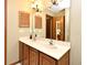 Bathroom features a double sink vanity, shuttered cabinet, and neutral tones for a clean aesthetic at 1575 N Ridge Lake Cir, Longwood, FL 32750