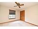 This bedroom features a ceiling fan, window with blinds and a closet at 1575 N Ridge Lake Cir, Longwood, FL 32750
