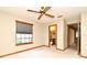 This bedroom features a ceiling fan and access to the bathroom at 1575 N Ridge Lake Cir, Longwood, FL 32750