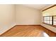 Cozy bedroom features natural light from the window, and hardwood floors at 1575 N Ridge Lake Cir, Longwood, FL 32750