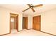 This bedroom includes a ceiling fan and access to the bathroom and closet at 1575 N Ridge Lake Cir, Longwood, FL 32750