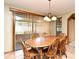 Traditional dining room featuring wood table, chairs, and natural light from sliding glass doors at 1575 N Ridge Lake Cir, Longwood, FL 32750
