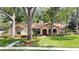 Charming single story home with mature landscaping and beautiful lawn at 1575 N Ridge Lake Cir, Longwood, FL 32750