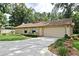 Spacious home with a well-manicured lawn and a large, two-car garage at 1575 N Ridge Lake Cir, Longwood, FL 32750