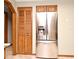 Modern refrigerator with built-in ice and water dispenser, paired with a wooden pantry at 1575 N Ridge Lake Cir, Longwood, FL 32750