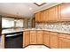 A spacious kitchen featuring modern appliances, wood cabinets and granite countertops at 1575 N Ridge Lake Cir, Longwood, FL 32750