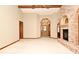 Open living room with a brick fireplace, neutral walls, and wood trim at 1575 N Ridge Lake Cir, Longwood, FL 32750