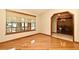 Living room with a window and hardwood floors, also shows the dining room at 1575 N Ridge Lake Cir, Longwood, FL 32750